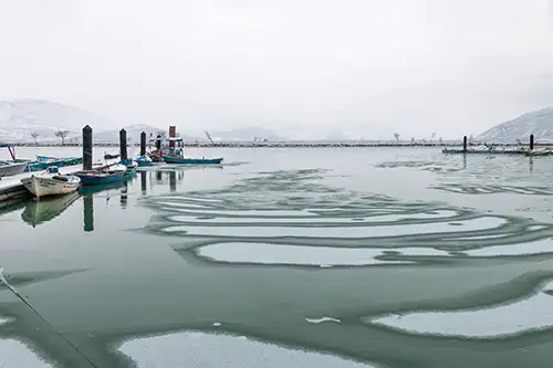 snowy shoreline frozen lakefront & winter boats collection (155)